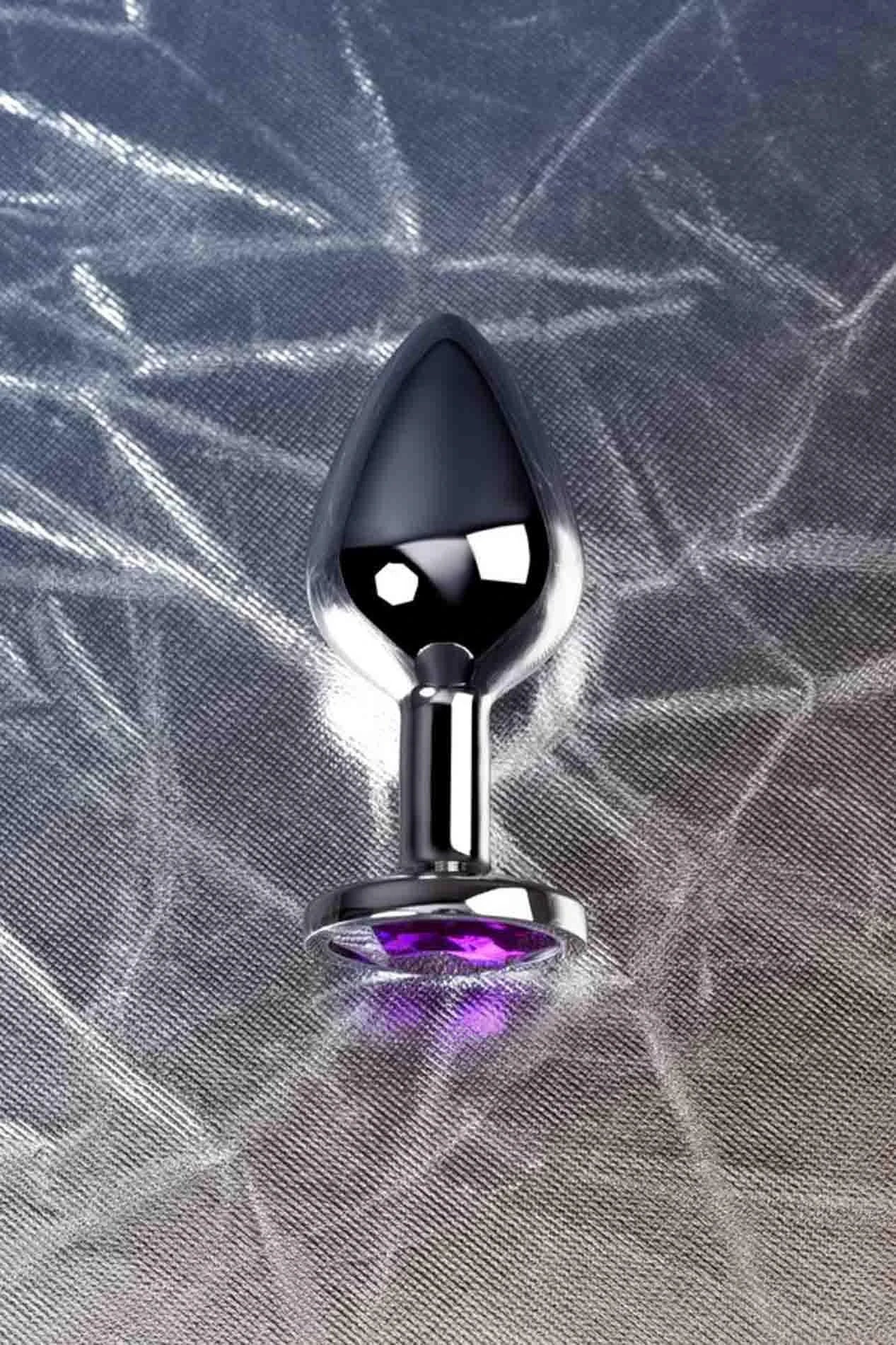 Silver anal plug TOYFA Metal,with a amethyst colored gem