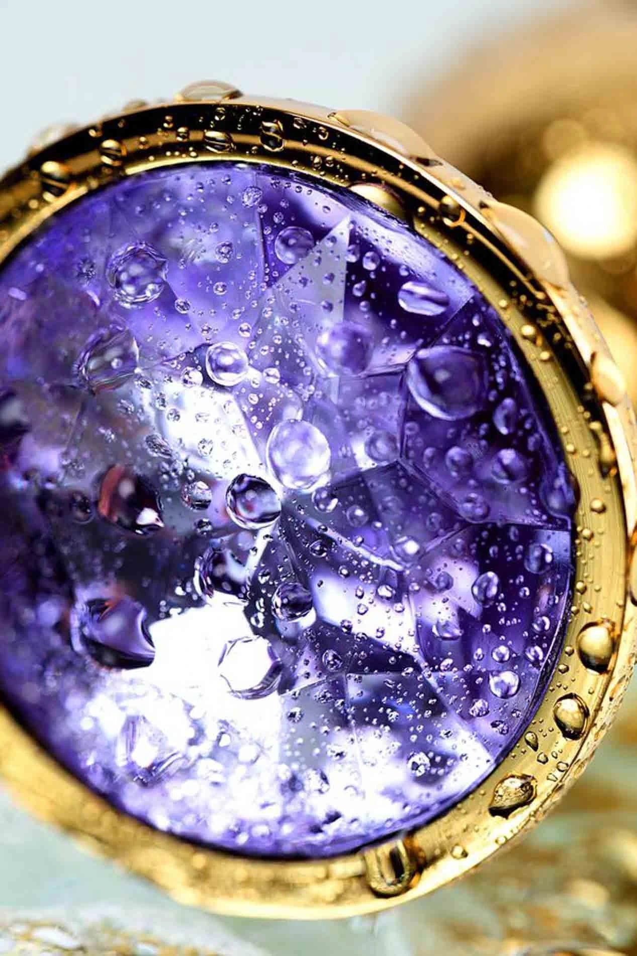 Golden anal plug TOYFA Metal,with a amethyst colored gem