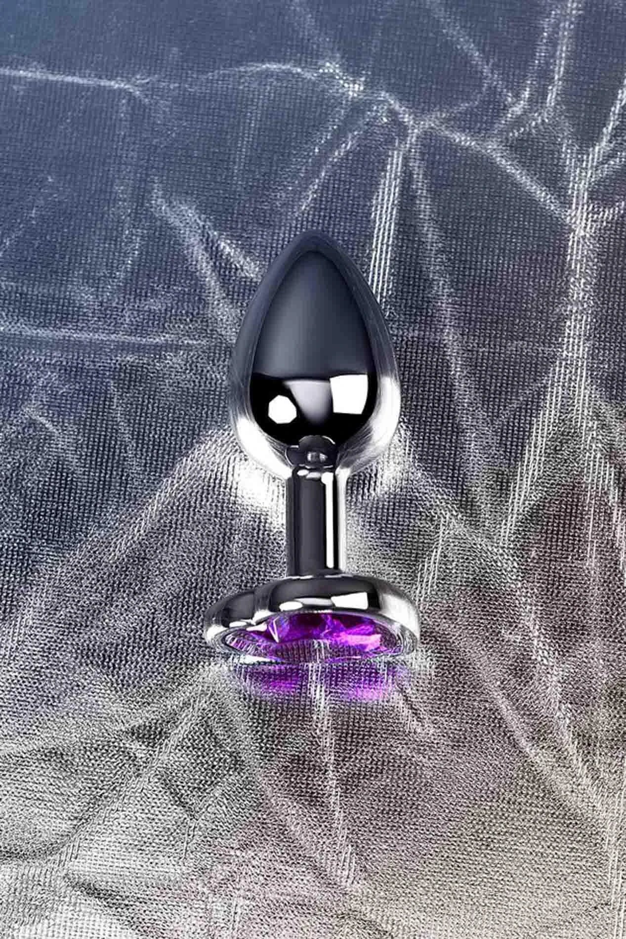 Silver anal plug with purple heart-shaped gem